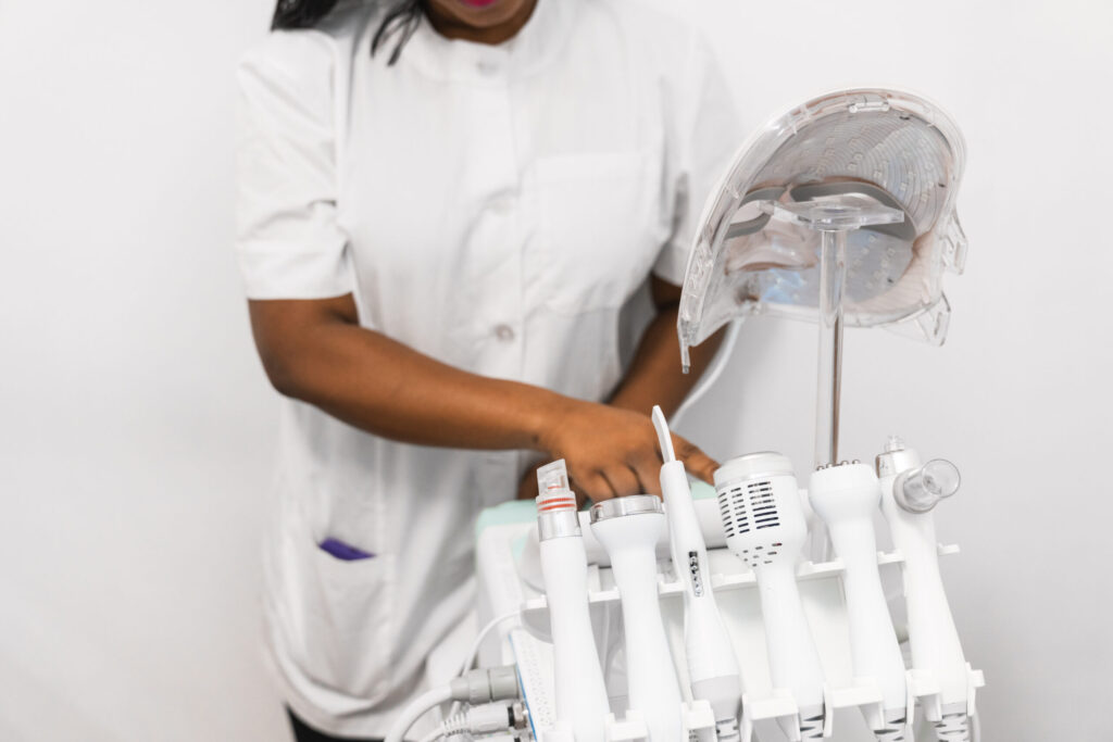 Wellness expert adjusts iTeraCare Wand at Just Breathe by Jodi spa in Cave Creek, AZ, enhancing relaxation and stress relief.