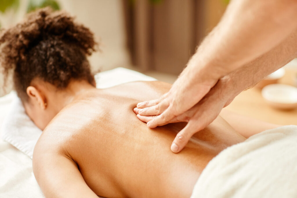 Massage therapist performing stress relief spa therapy at Just Breathe by Jodi, Cave Creek, AZ; relaxation and wellness.