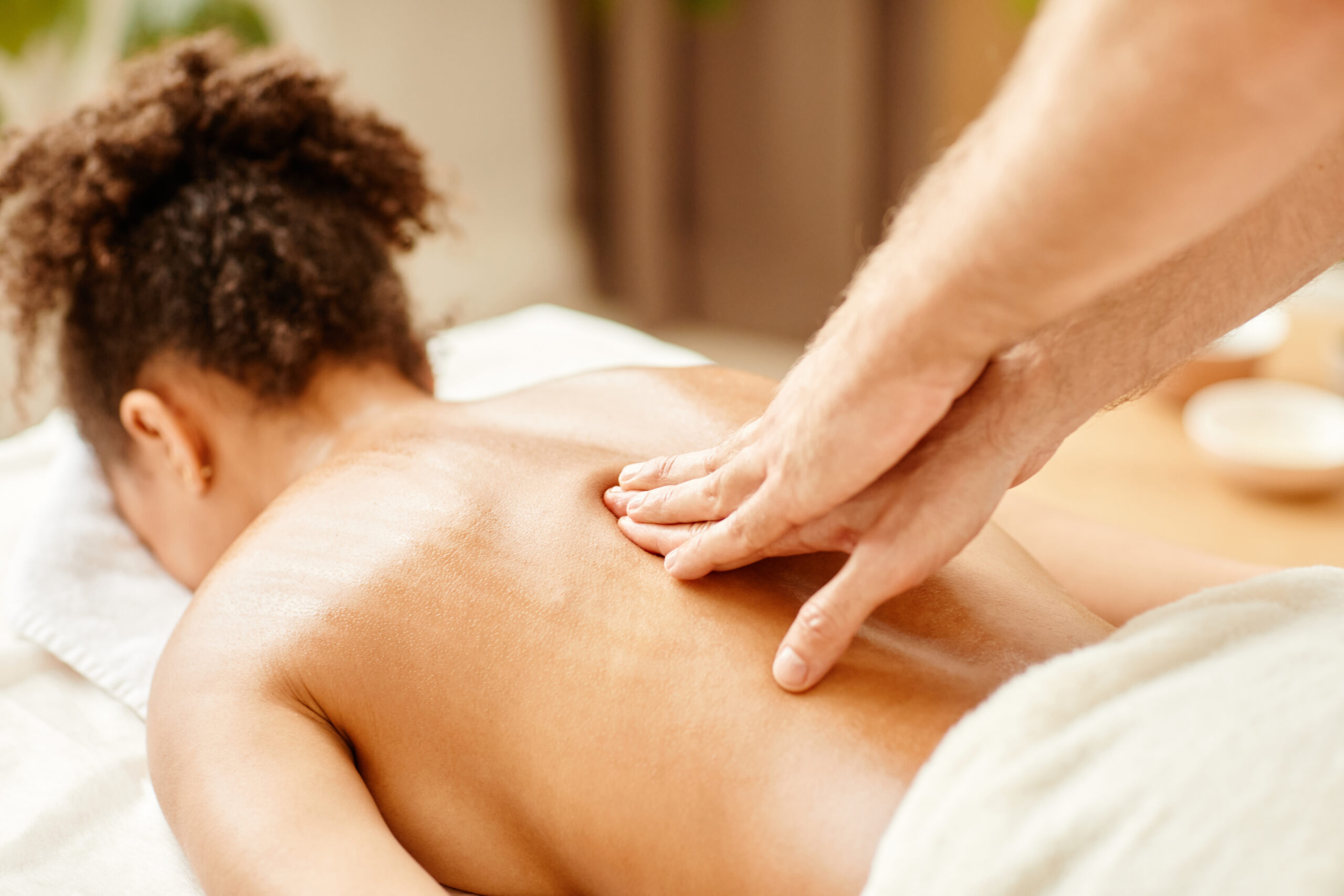 Massage therapist performing stress relief spa therapy at Just Breathe by Jodi, Cave Creek, AZ; relaxation and wellness.